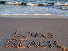 "Long Beach" written in sand